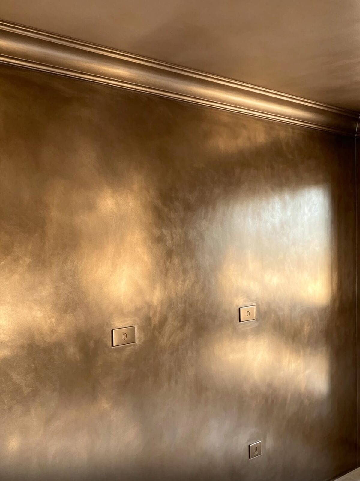 Polished plaster · bronze feature wall by Artisan Bespoke Walls and Floors, London and Kent